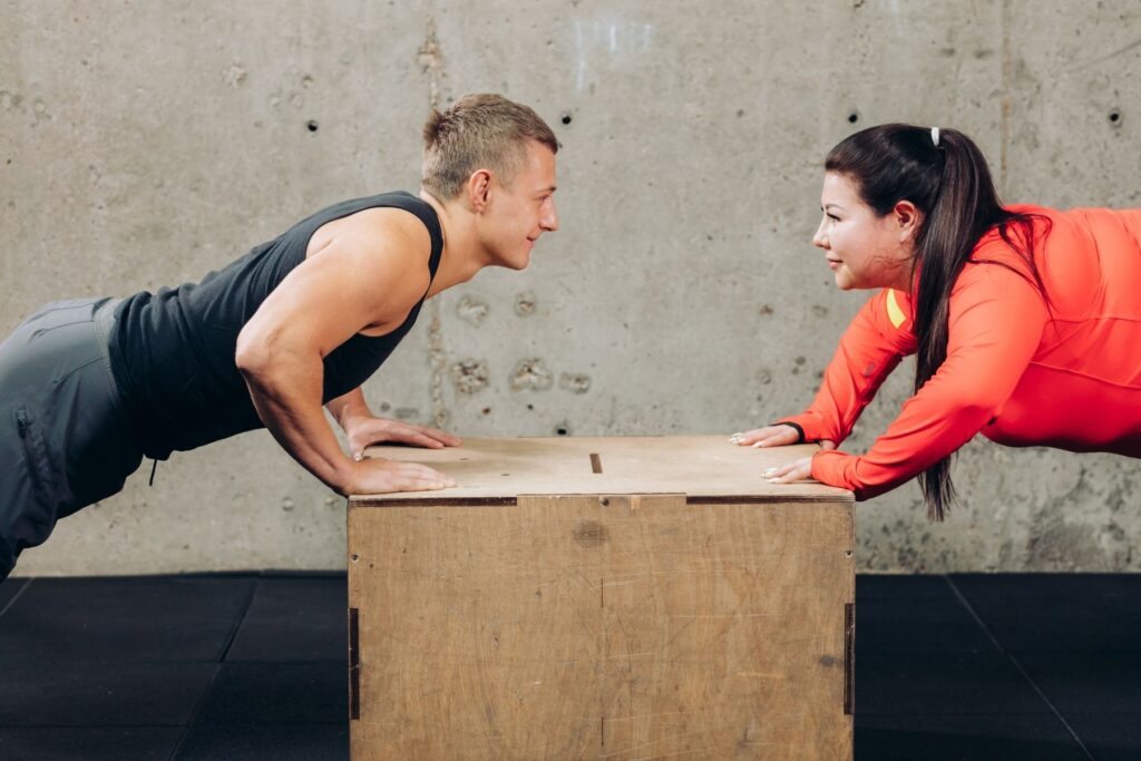 Guy and Lady Doing Inclined Pushups